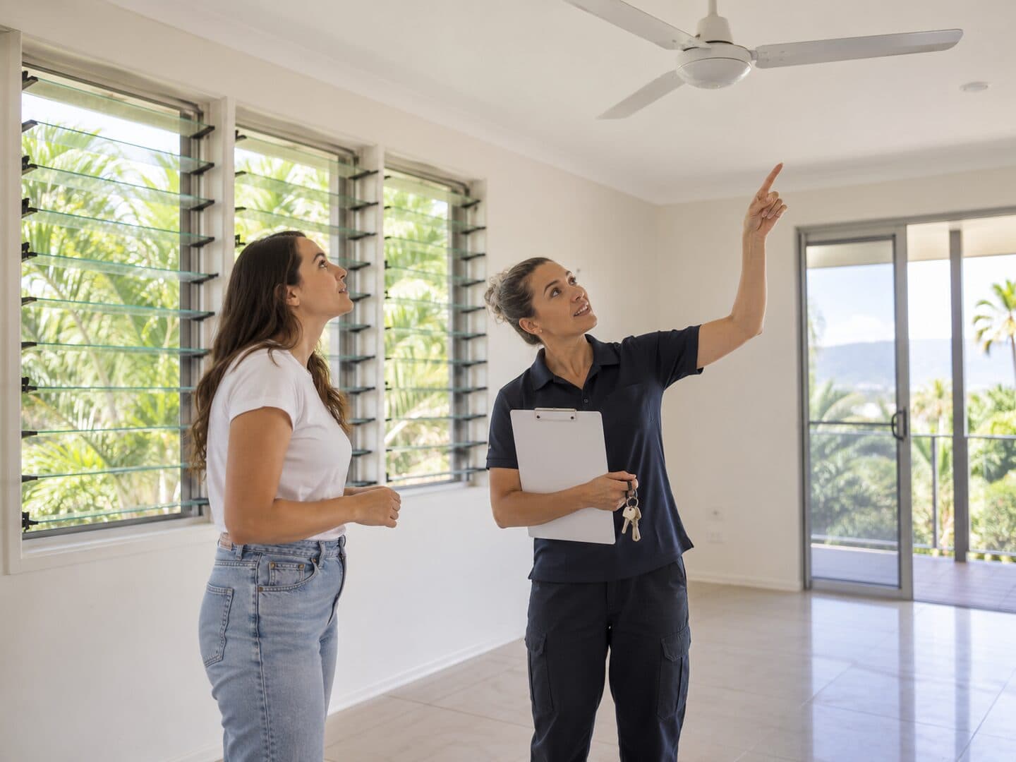 Tenant discussing property access details with an end of lease cleaner