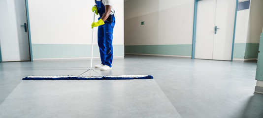 Reasons for Commercial End of Lease Cleaning Service 2 Cleaner mopping a commercial space during end-of-lease cleaning. Ensuring the area is spotless for final inspections.