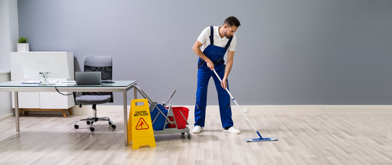 Reasons for Commercial End of Lease Cleaning Service 4 Cleaner mopping office floors during end-of-lease cleaning. Preparing the space for a smooth transition.