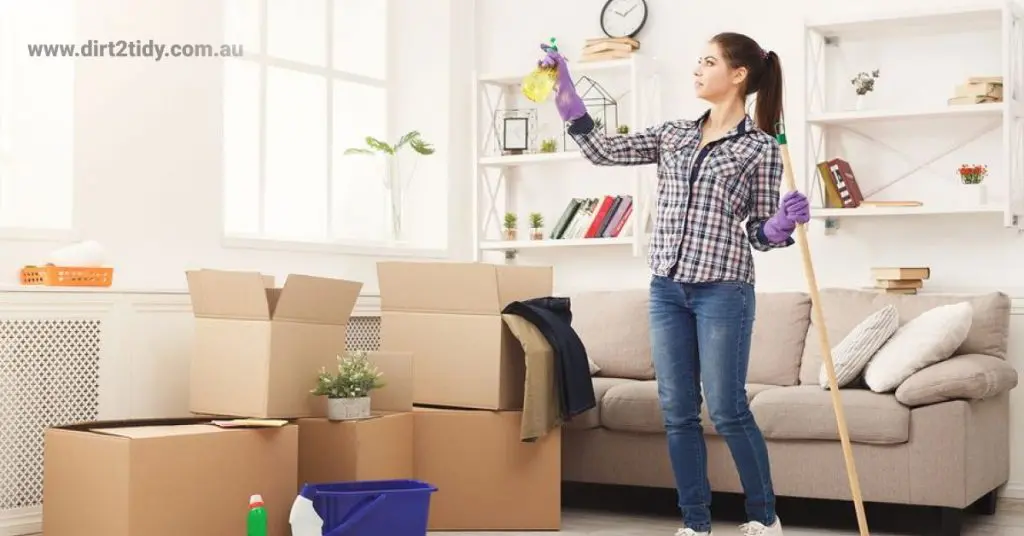 A Person cleaning the room while preparing for moving out