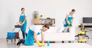 A professional cleaning team working in a bright living room during end of lease cleaning in Manly.

