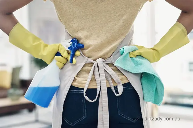 Need to do a Deep Clean for End of Lease Cleaning 2 Rear view of a cleaner with spray bottle and cloth in hand, ready for cleaning tasks.