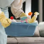 Bucket with assorted cleaning products