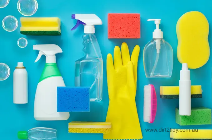 Various cleaning supplies including gloves, bottles, and sponges.