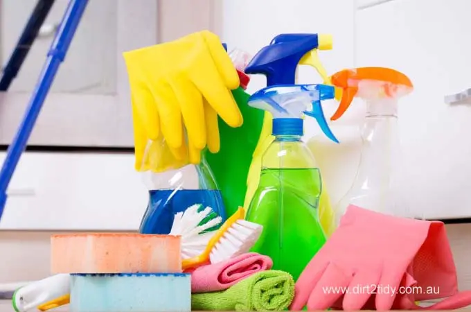End of Lease Cleaning: How to Impress Your Australian Landlord 3 Collection of cleaning sprays, gloves, sponges, and cloths on the floor.
