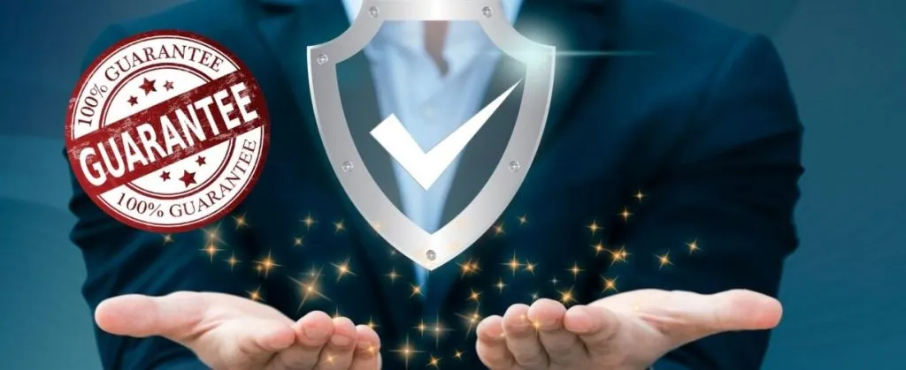 How to Ensure Tenant Satisfaction with End-of-Lease Cleaning 3 Businessperson holding a glowing shield with a 100 percent guarantee badge.